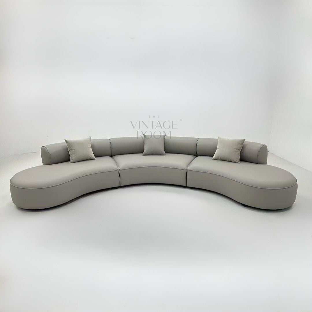 Luxury curved Valence sofa in premium fabric with matching cushions