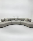 Luxury curved Valence sofa in premium fabric with matching cushions